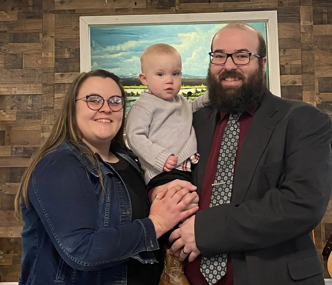 Pastor Jonathan Redd with his wife, Megan, and their son, Samuel