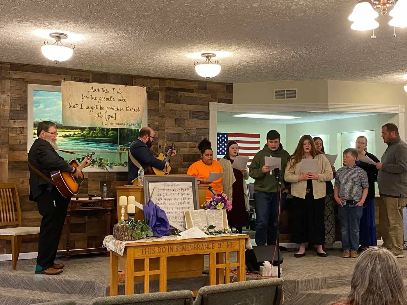 Young people singing at the front of the church